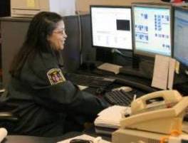 Police Dispatcher working at dispatch center