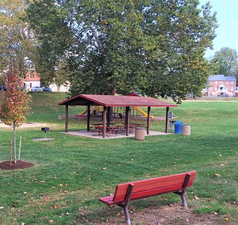 red park bench and outdoor pavilion