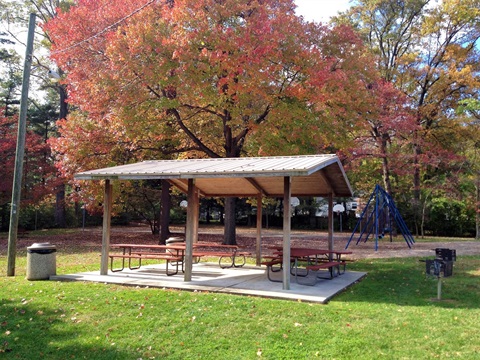 white outdoor pavilion with picnic tables