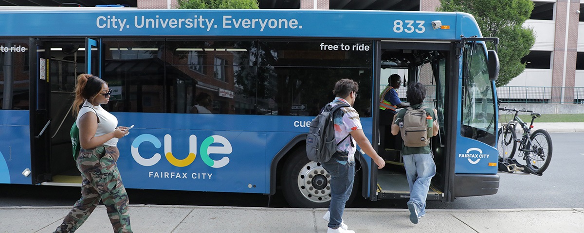 Image of people boarding CUE bus